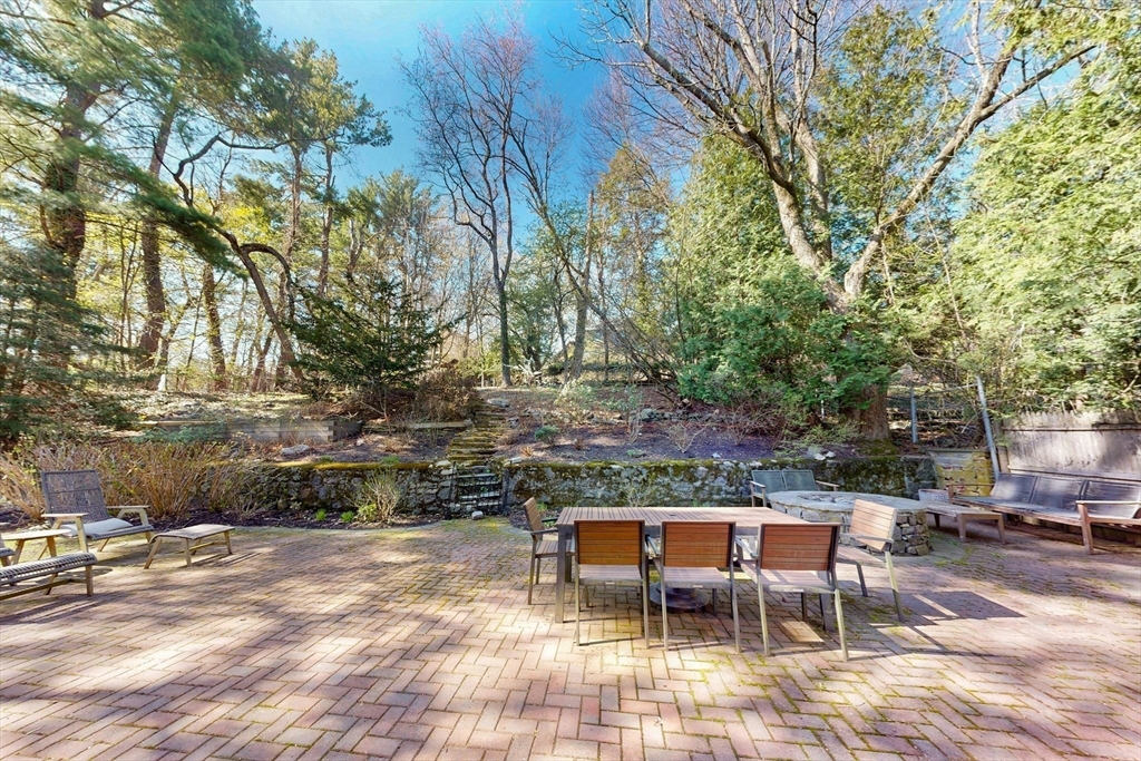 32 Alberta Road Brookline, MA 02467 - Photo 14 of 36 a view of backyard with seating area and trees