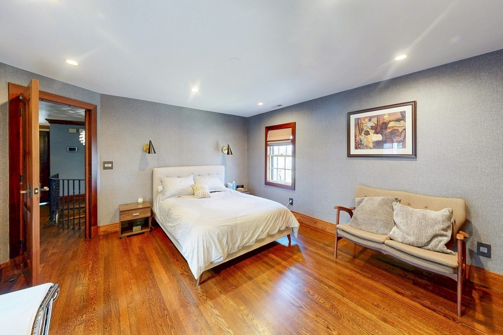 32 Alberta Road Brookline, MA 02467 - Photo 15 of 36 a bedroom with a bed and wooden floor