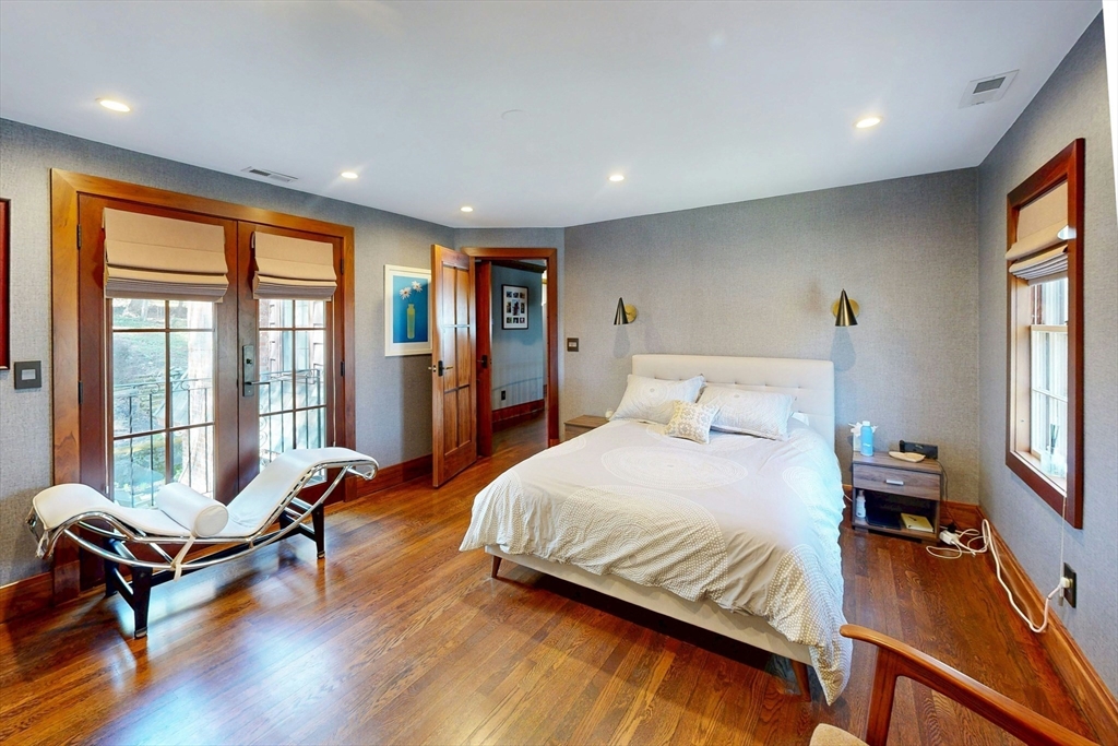 32 Alberta Road Brookline, MA 02467 - Photo 16 of 36 a spacious bedroom with a bed and a large window