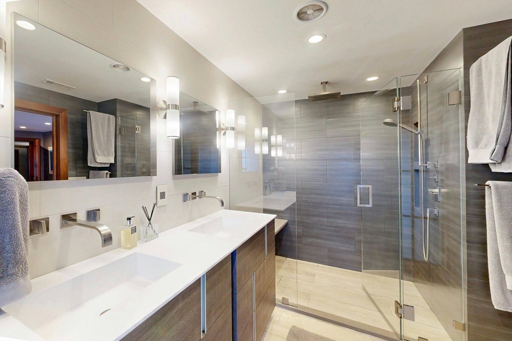 32 Alberta Road Brookline, MA 02467 - Photo 19 of 36 a bathroom with a bathtub sink vanity granite and shower
