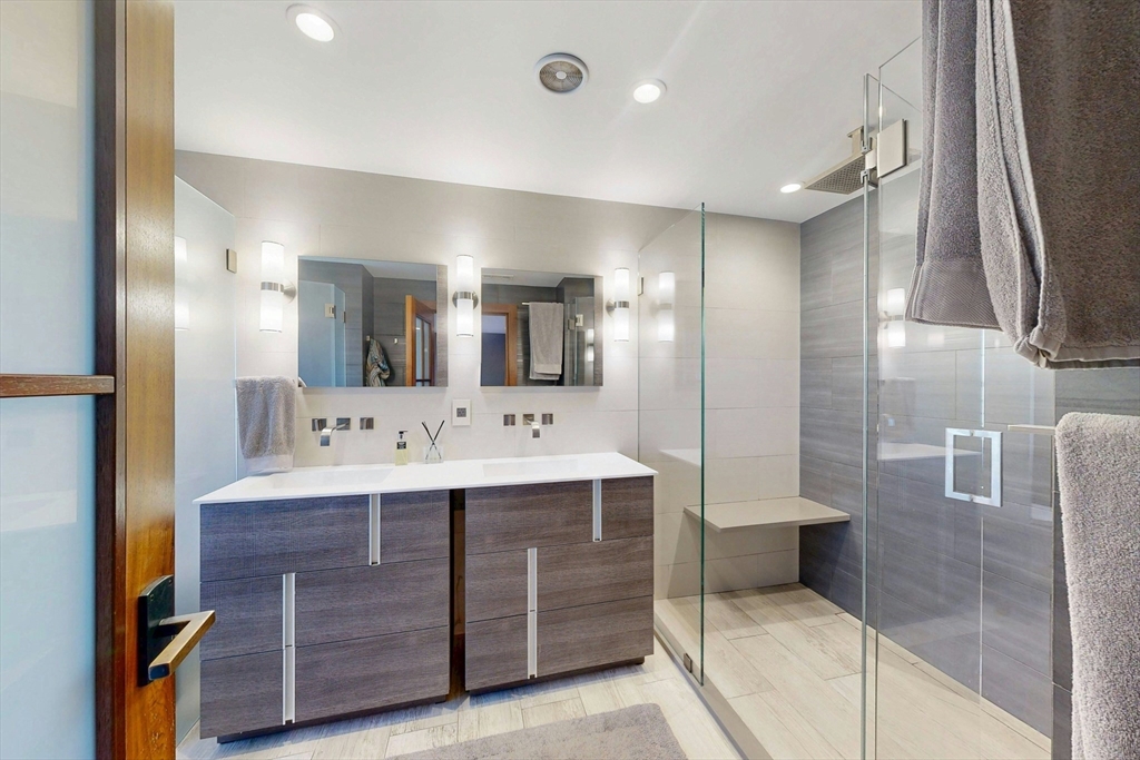 32 Alberta Road Brookline, MA 02467 - Photo 20 of 36 a bathroom with a sink double vanity granite and a mirror