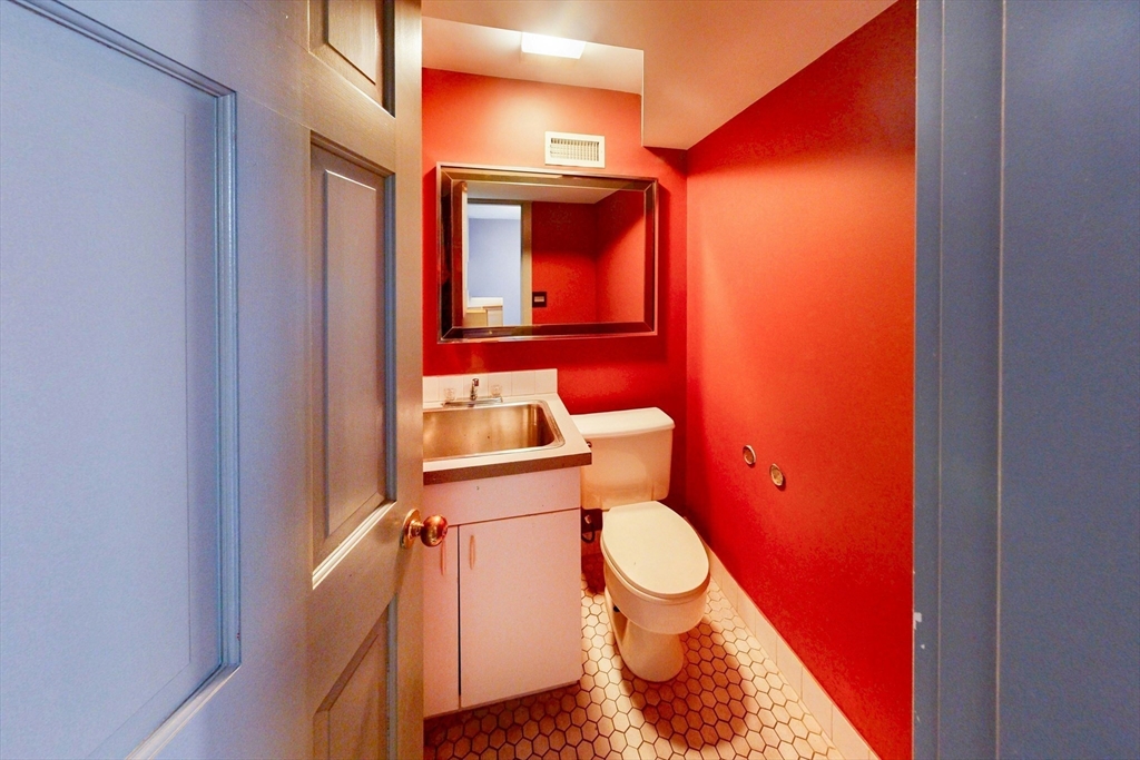 32 Alberta Road Brookline, MA 02467 - Photo 21 of 36 a bathroom with a toilet and a sink