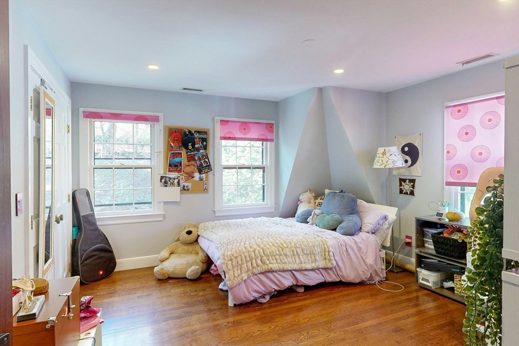 32 Alberta Road Brookline, MA 02467 - Photo 22 of 36 a bedroom with a bed and wooden floor