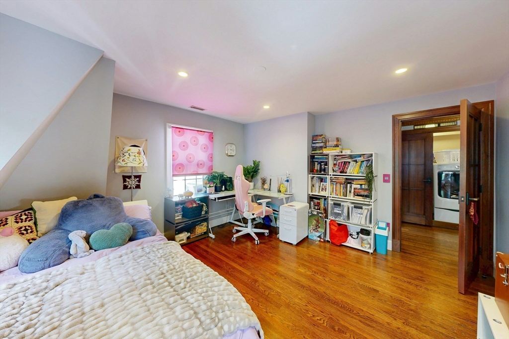 32 Alberta Road Brookline, MA 02467 - Photo 24 of 36 a bed room with a bed and a book shelf