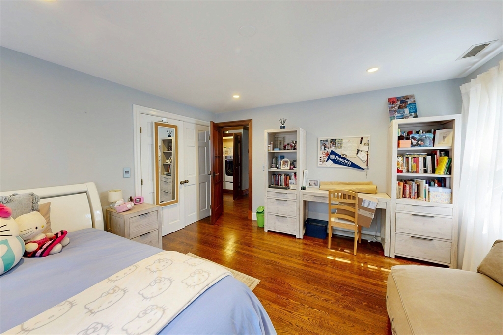 32 Alberta Road Brookline, MA 02467 - Photo 25 of 36 a room with furniture and a book shelf