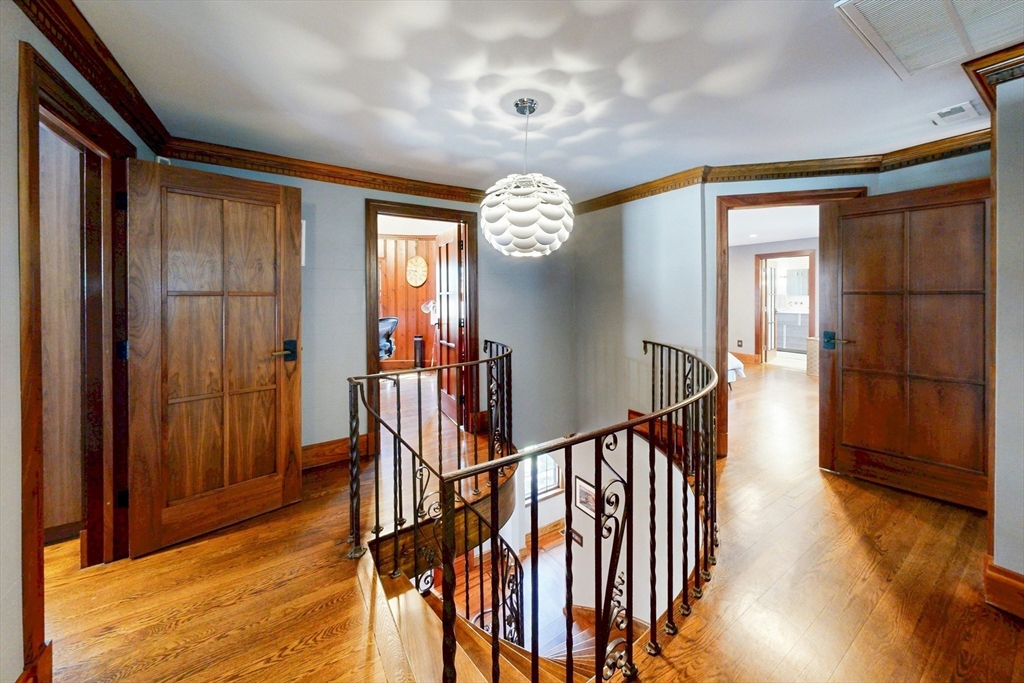 32 Alberta Road Brookline, MA 02467 - Photo 31 of 36 a view of a hallway with wooden floor and staircase