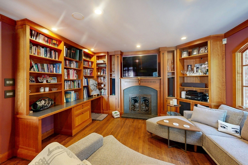32 Alberta Road Brookline, MA 02467 - Photo 8 of 36 a living room with furniture and a fireplace