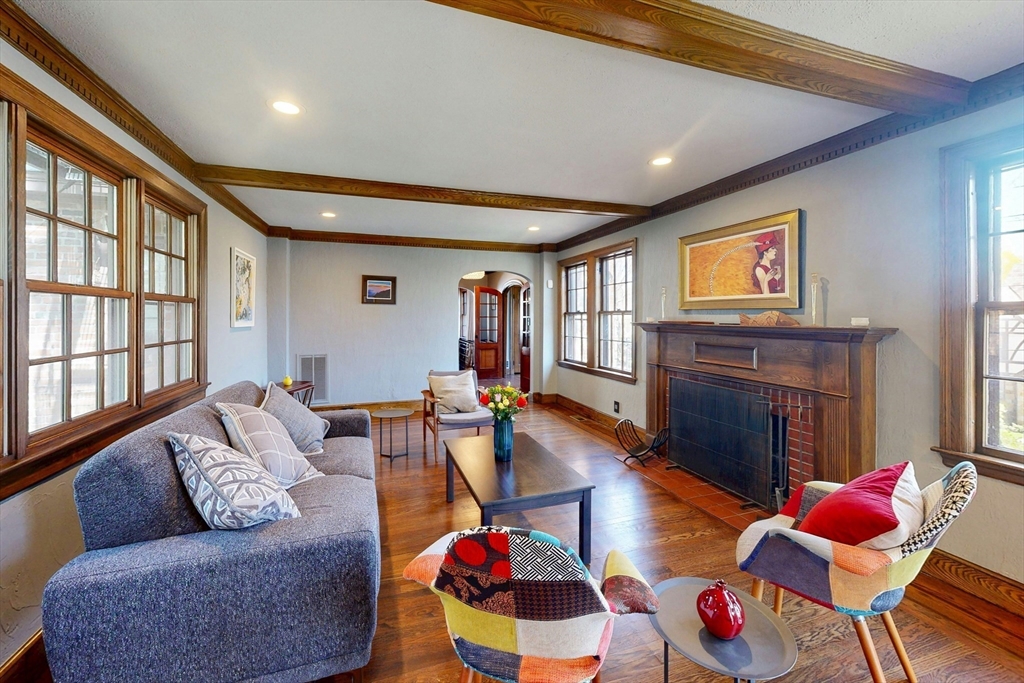 32 Alberta Road Brookline, MA 02467 - Photo 9 of 36 a living room with furniture and a fireplace