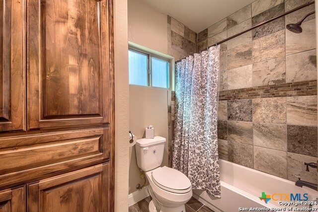 6197 Pfeil Road Schertz, TX 78154 - Photo 11 of 29 a bathroom with a toilet and a shower