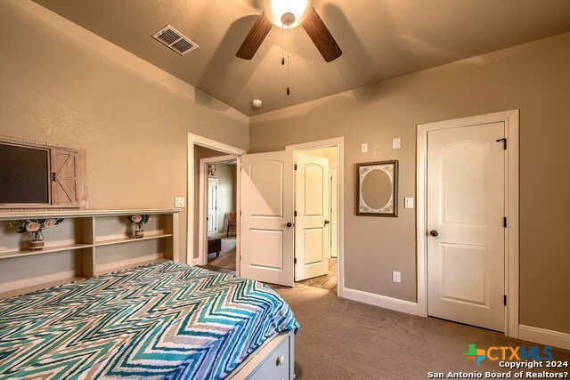 6197 Pfeil Road Schertz, TX 78154 - Photo 18 of 29 a bedroom with a bed and a view of kitchen