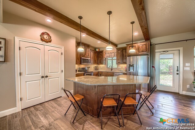 6197 Pfeil Road Schertz, TX 78154 - Photo 8 of 29 a dining table with chairs and wooden floor