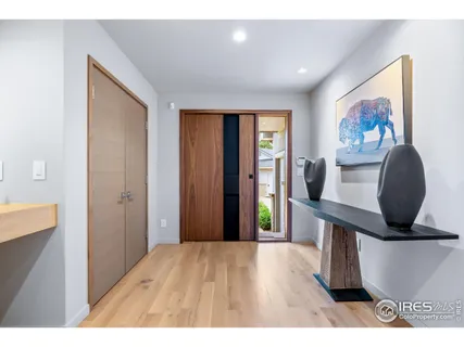 a view of a living room and wooden floor