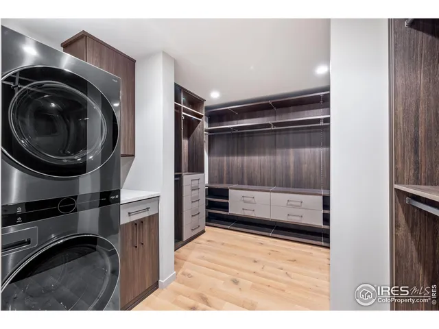 a kitchen with a refrigerator and cabinets
