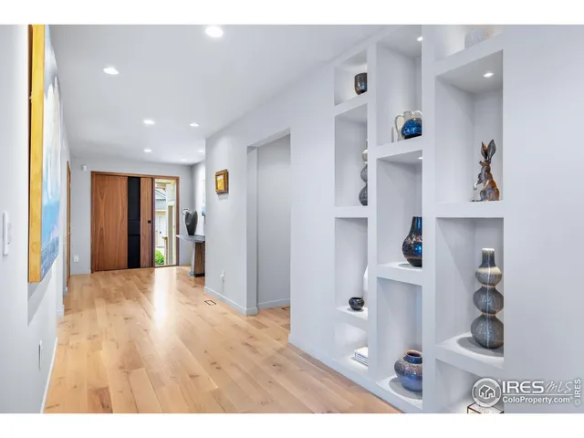 a open kitchen with refrigerator and window