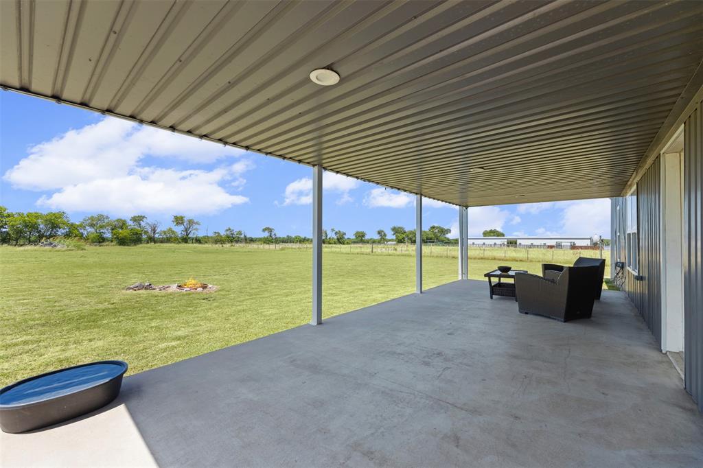 511 East Pecan Tree Road Waxahachie, TX 75165 - Photo 5 of 36 Expansive covered back patio overlooking wide-open acreage!
