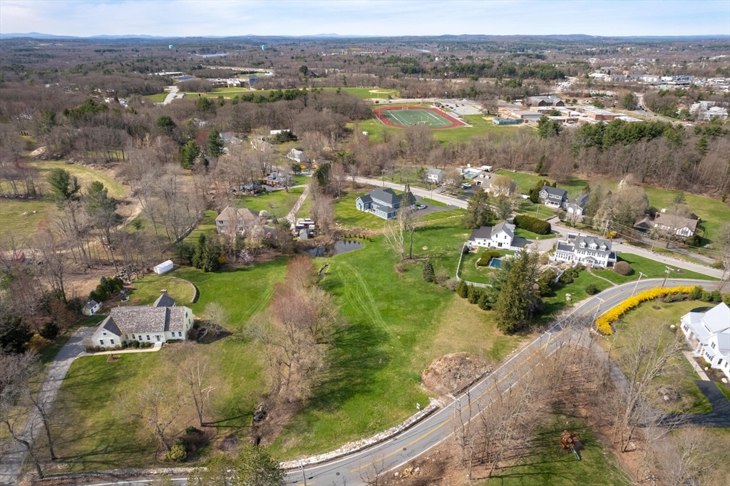 0 Locke Road Chelmsford, MA 01824 - Photo 17 of 18 an aerial view of lake residential house with swimming pool and green space
