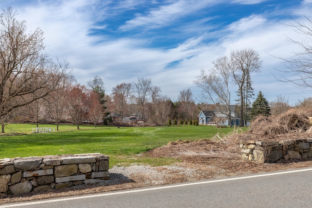 0 Locke Road Chelmsford, MA 01824 - Photo 4 of 18 a view of a yard with a large tree