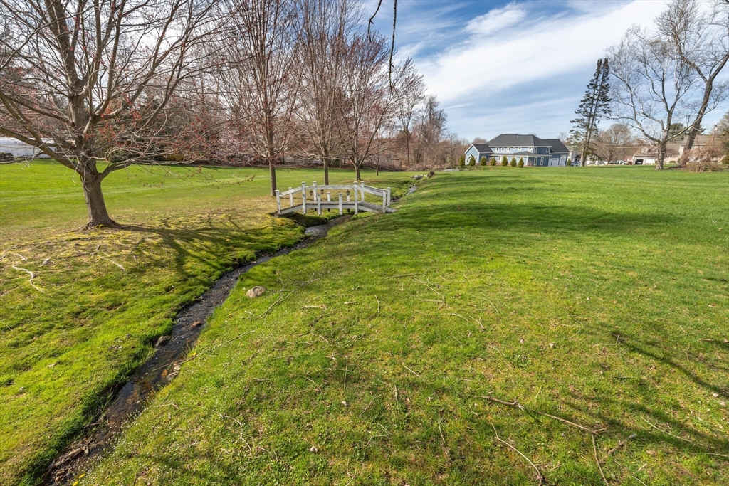 0 Locke Road Chelmsford, MA 01824 - Photo 8 of 18 a view of a field with a tree
