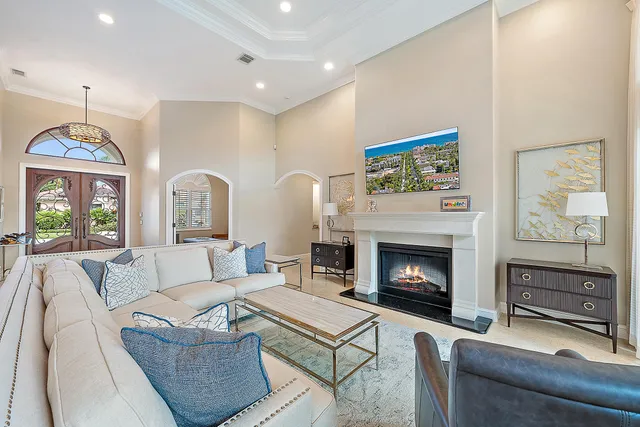 a living room with furniture a window and a fireplace