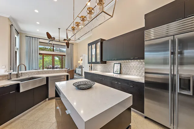 a kitchen with a stove a sink and a refrigerator