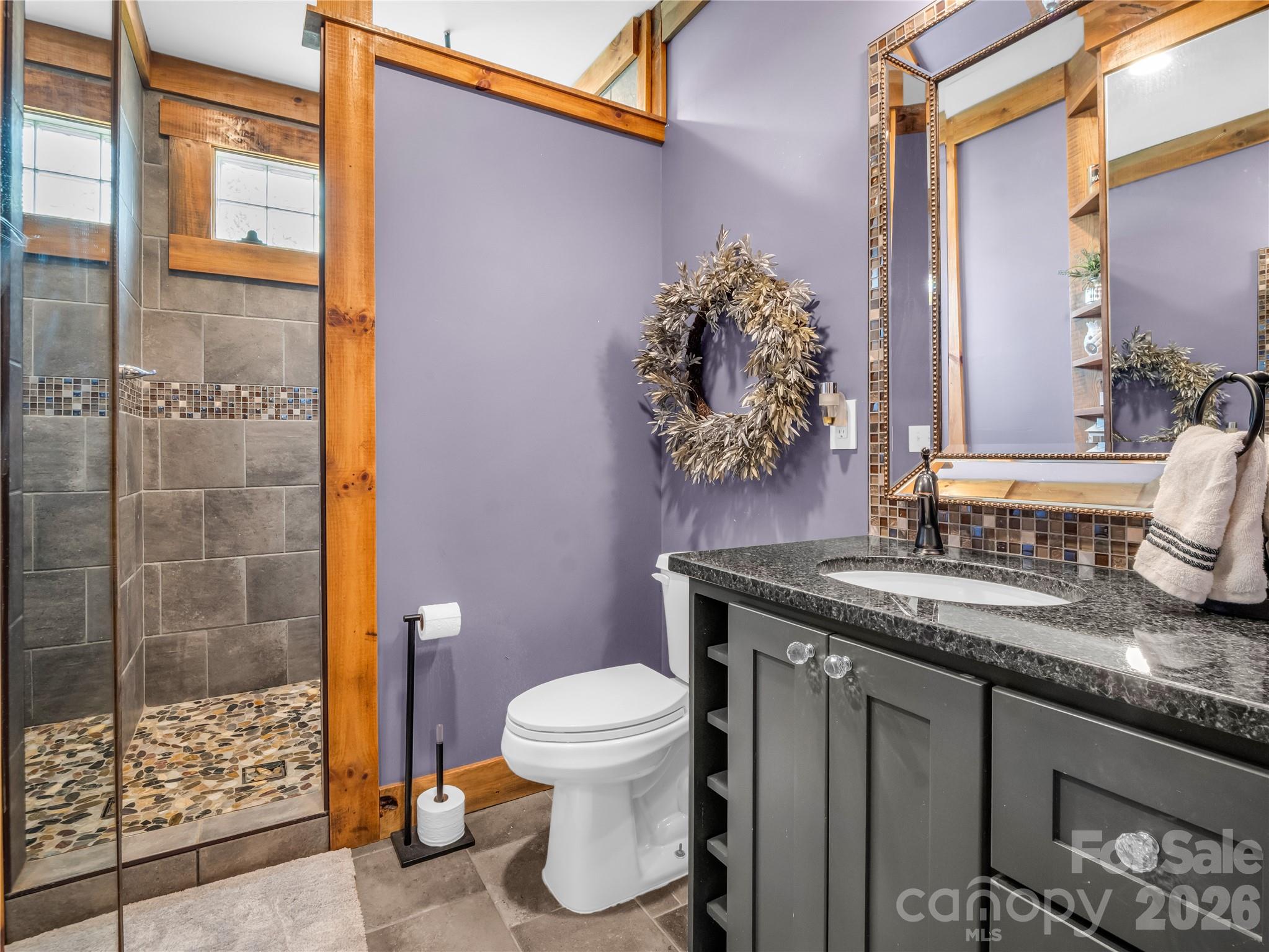 755 Depriest Road Bostic, NC 28018 - Photo 16 of 38 a bathroom with a granite countertop sink a toilet and shower