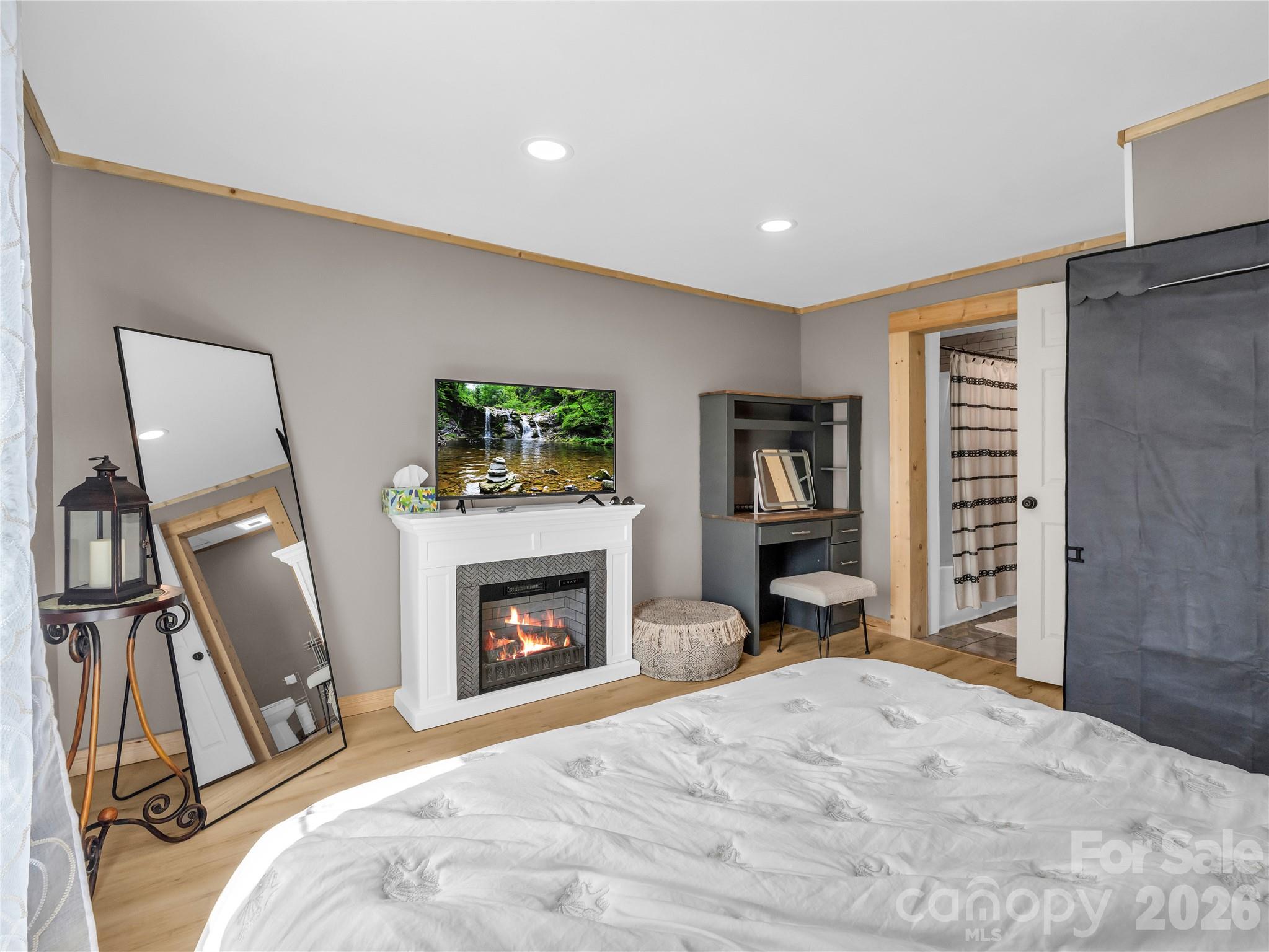 755 Depriest Road Bostic, NC 28018 - Photo 18 of 38 a bedroom with a bed and a fireplace