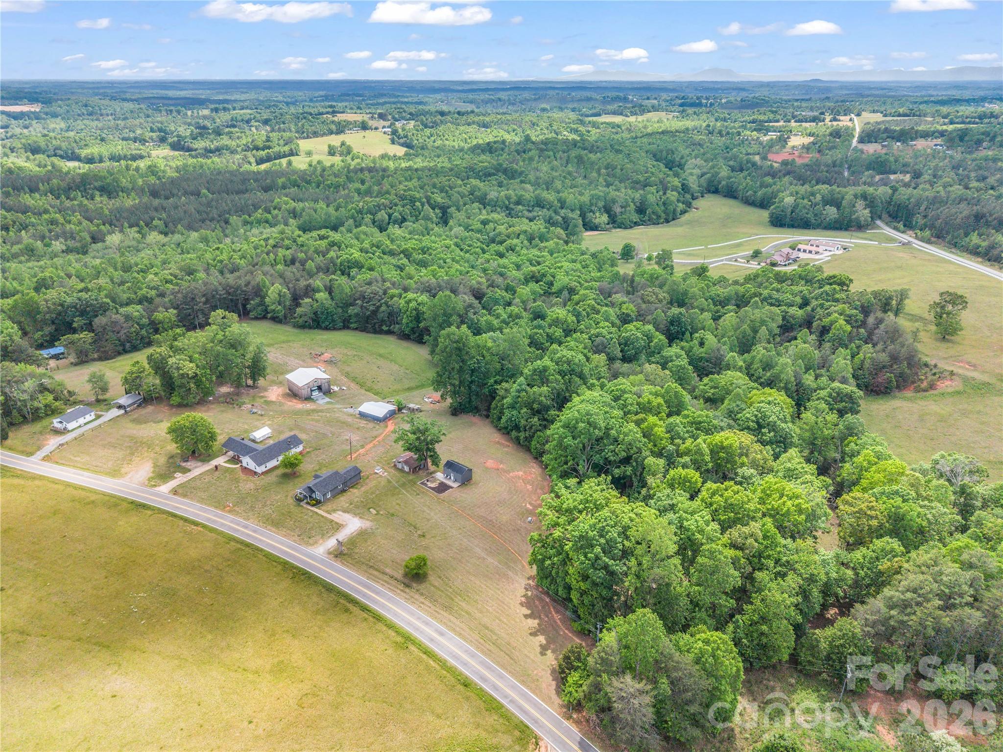 755 Depriest Road Bostic, NC 28018 - Photo 35 of 38 a view of a back yard of a house with a swimming pool