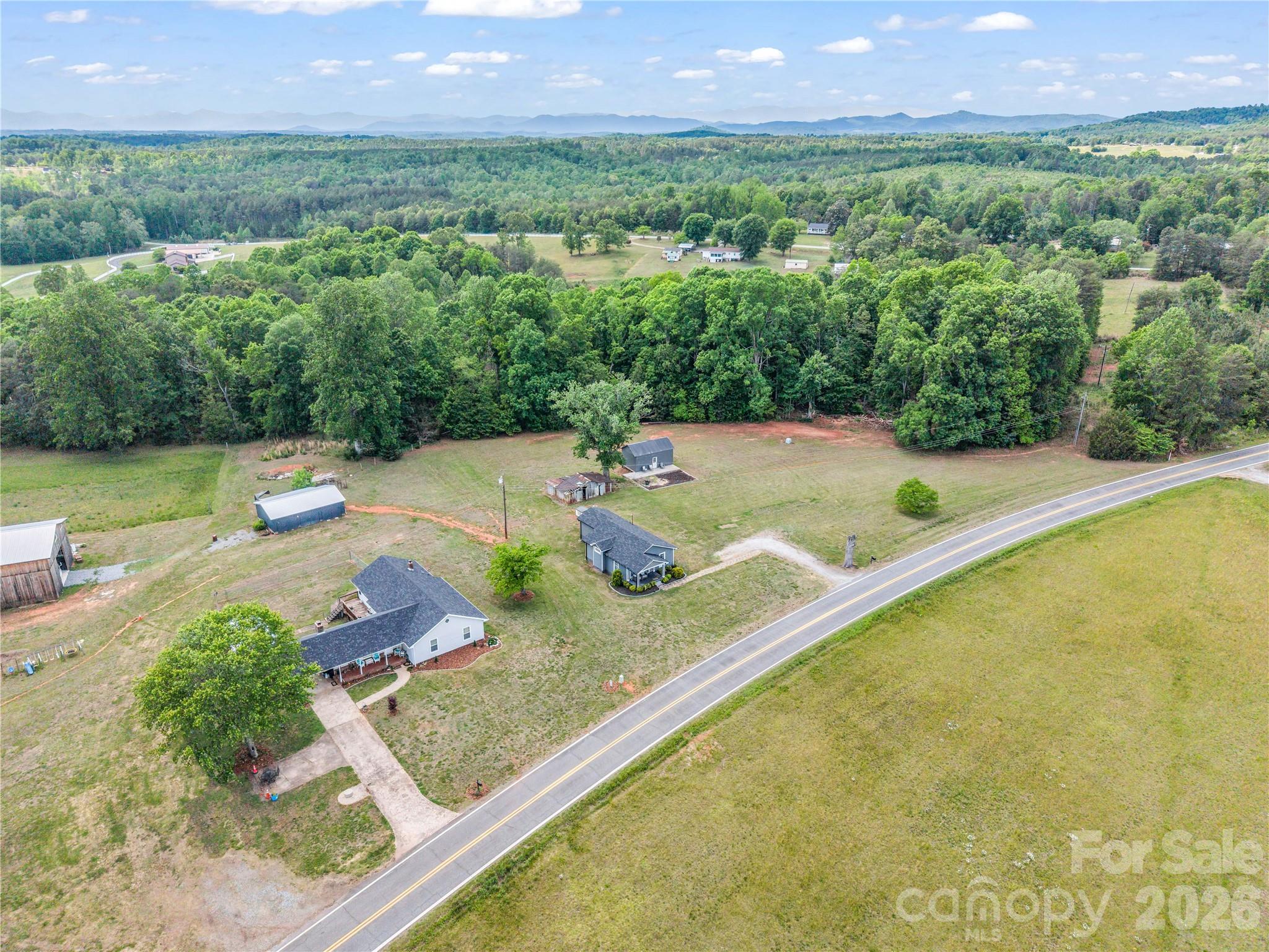 755 Depriest Road Bostic, NC 28018 - Photo 36 of 38 a view of a house with a yard and a large pool