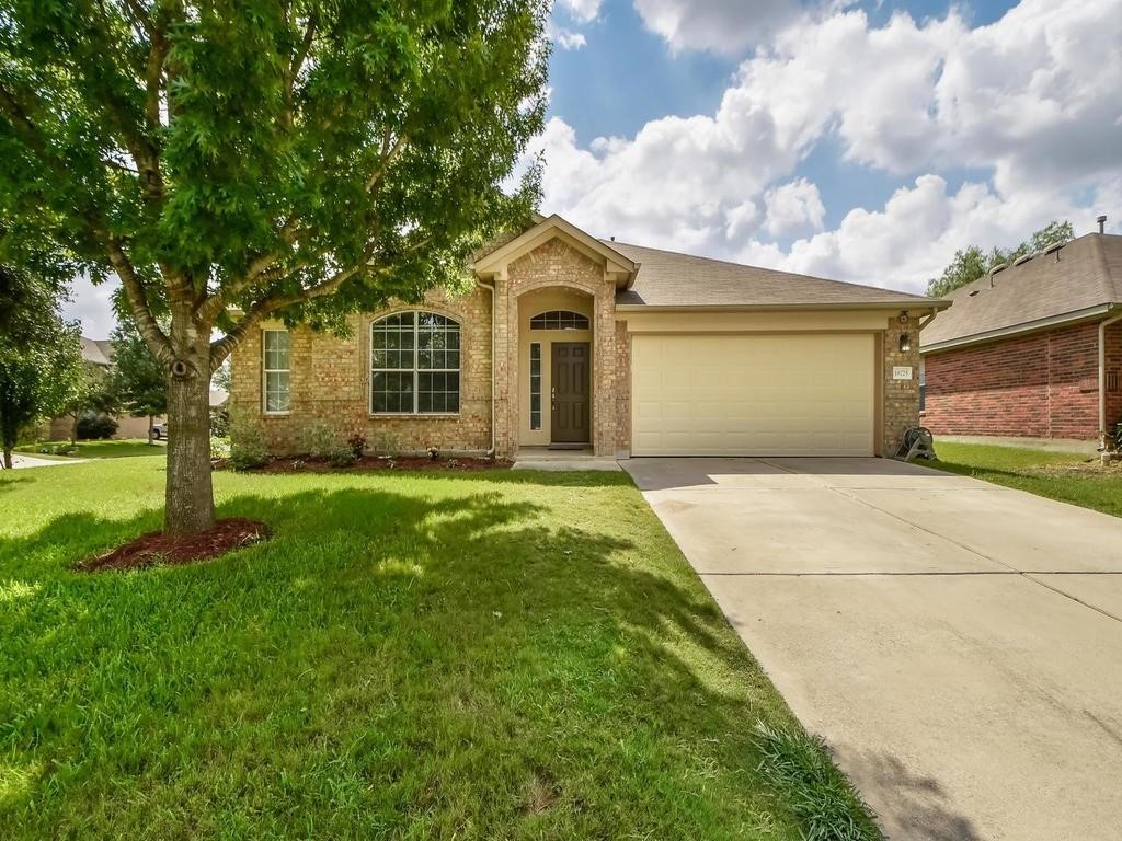 18725 Shoreless Drive Pflugerville, TX 78660 - Photo 1 of 1 a front view of a house with garden