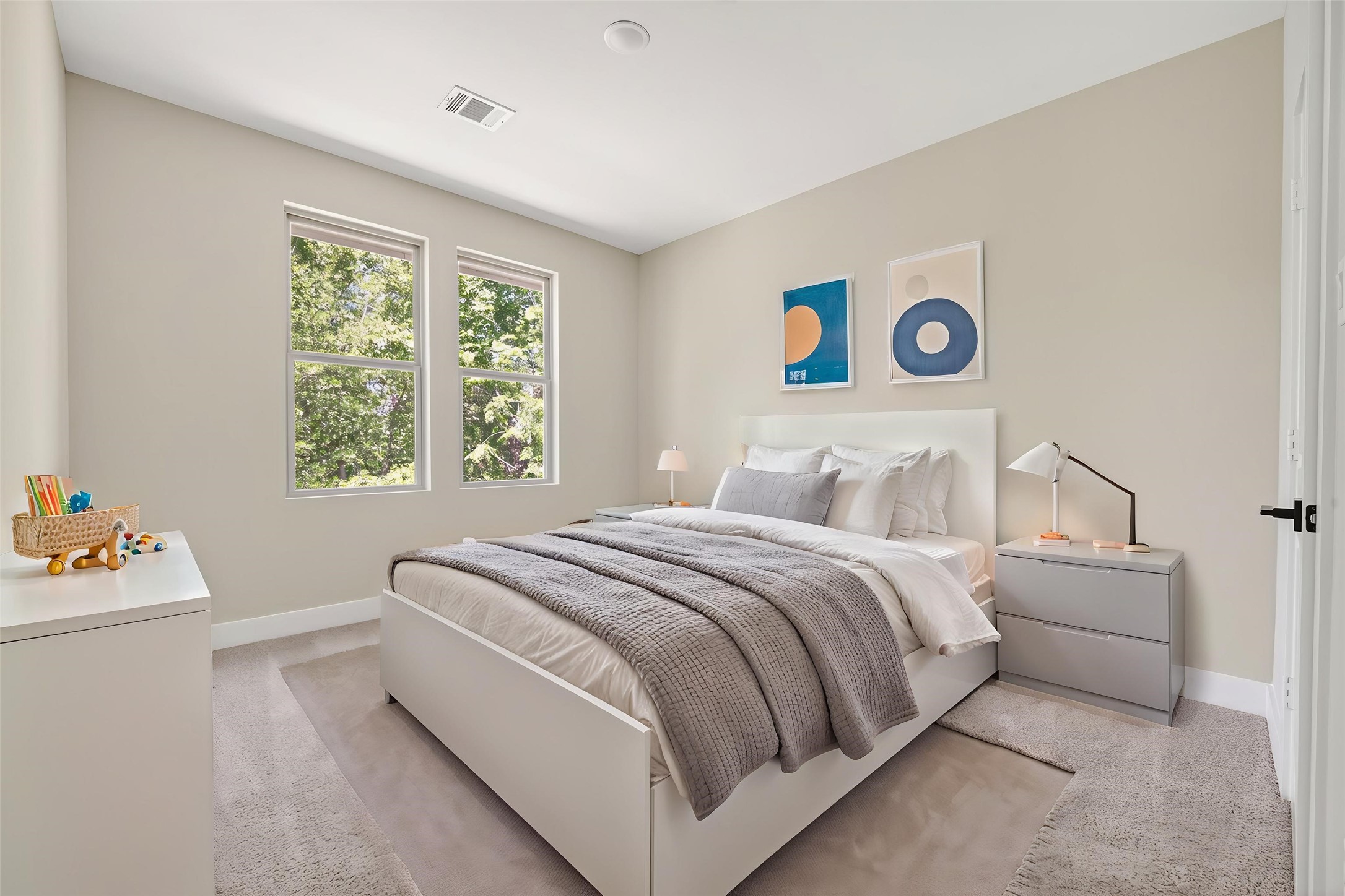 4930 Wunder Way Houston, TX 77069 - Photo 17 of 23 This beautifully AI-staged bedroom offers a serene, modern retreat with plush bedding, soft neutral tones, and sunlit views through large windows—perfect for unwinding in style.