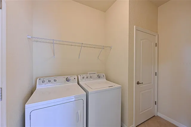 a view of a lake with houses in the back