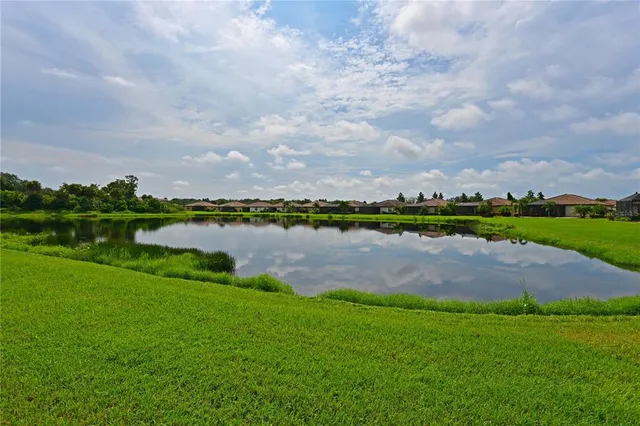 a front view of house with yard and swimming pool