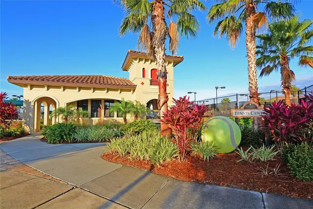 a view of a livingroom with a bookshelf and a large window