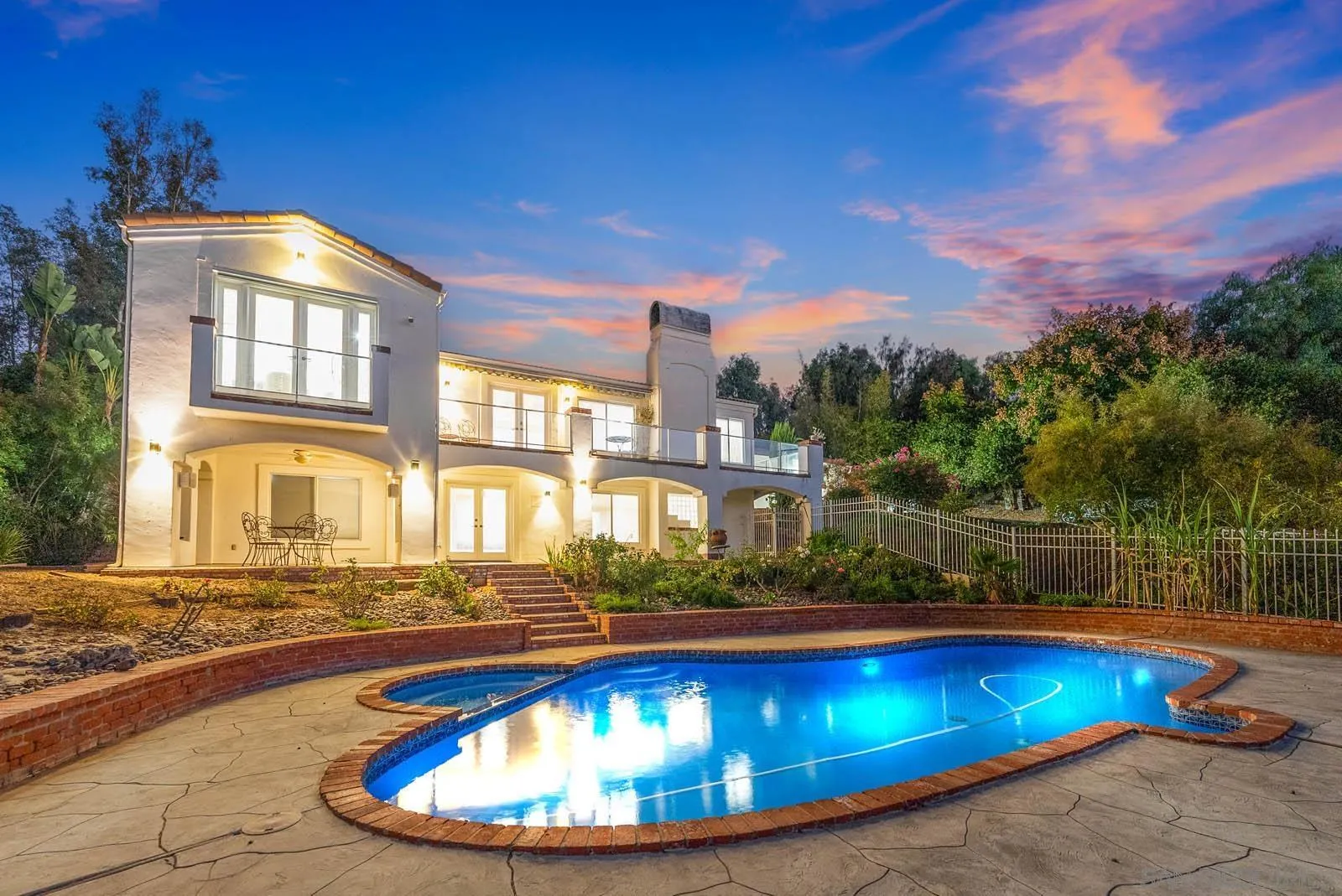 a view of a swimming pool with a patio