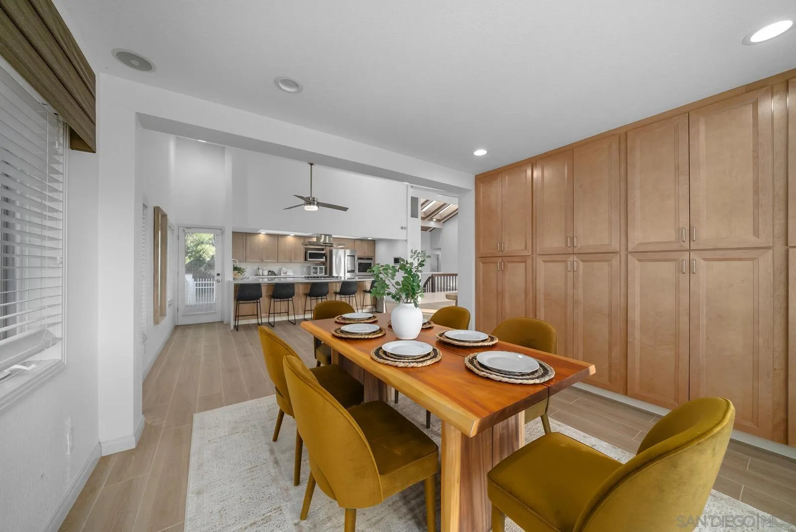 18695 Polvera Drive San Diego, CA 92128 - Photo 11 of 33 a view of a dining room with furniture and wooden floor