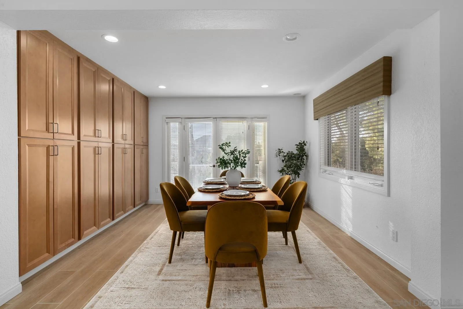 18695 Polvera Drive San Diego, CA 92128 - Photo 12 of 33 a dining room with furniture window and wooden floor