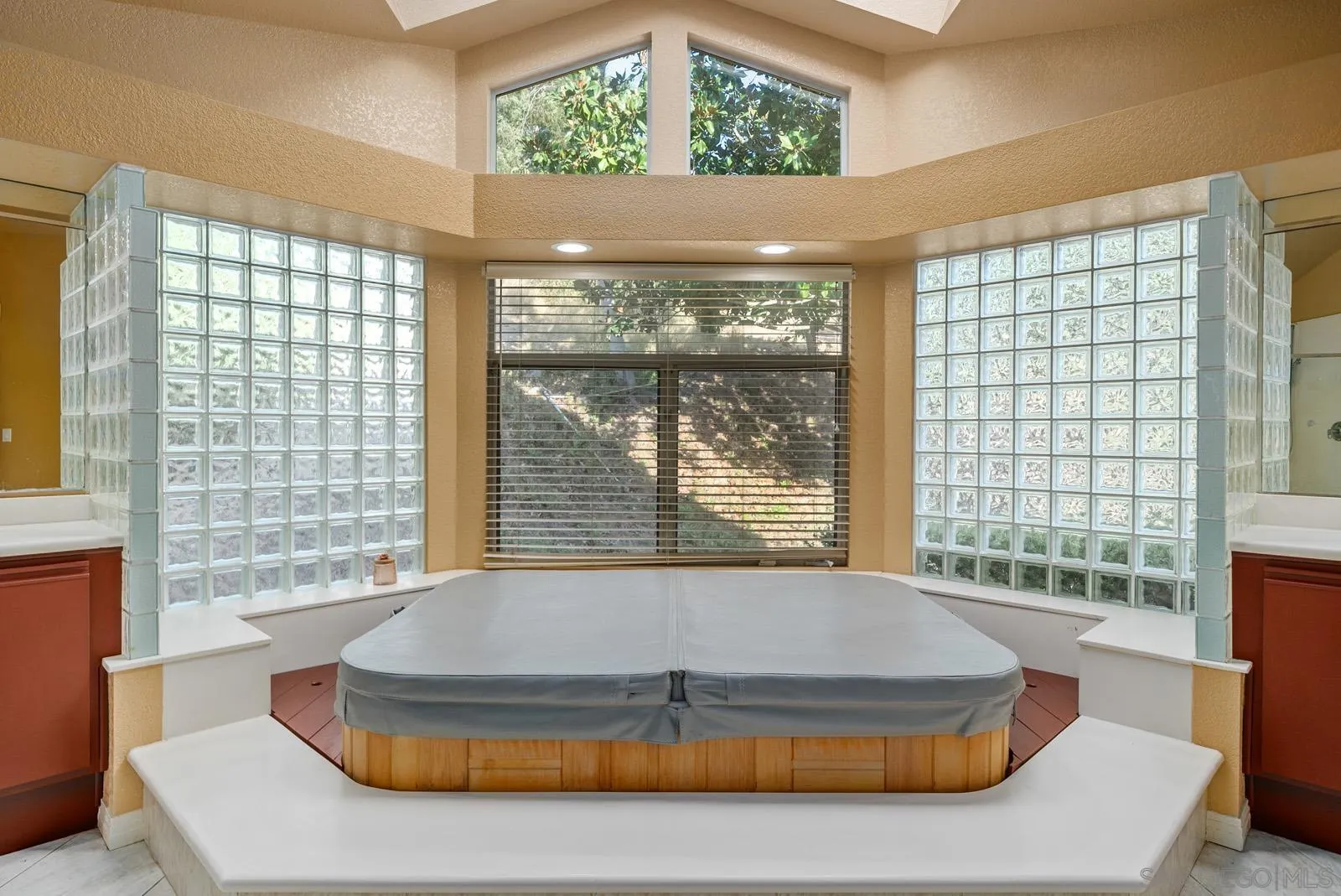 18695 Polvera Drive San Diego, CA 92128 - Photo 16 of 33 a living room with a large window and a table