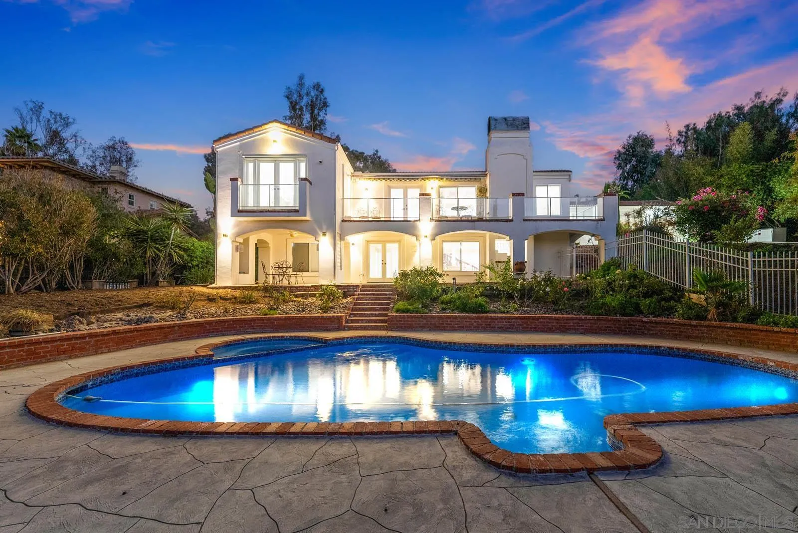 18695 Polvera Drive San Diego, CA 92128 - Photo 2 of 33 a view of a swimming pool with an outdoor seating