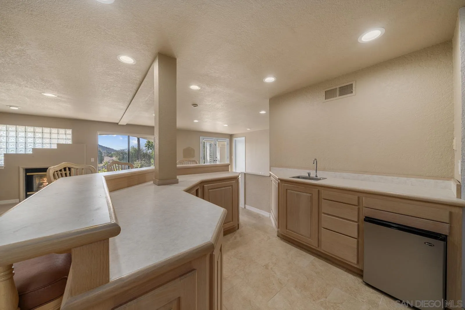 18695 Polvera Drive San Diego, CA 92128 - Photo 23 of 33 a view of kitchen and living room