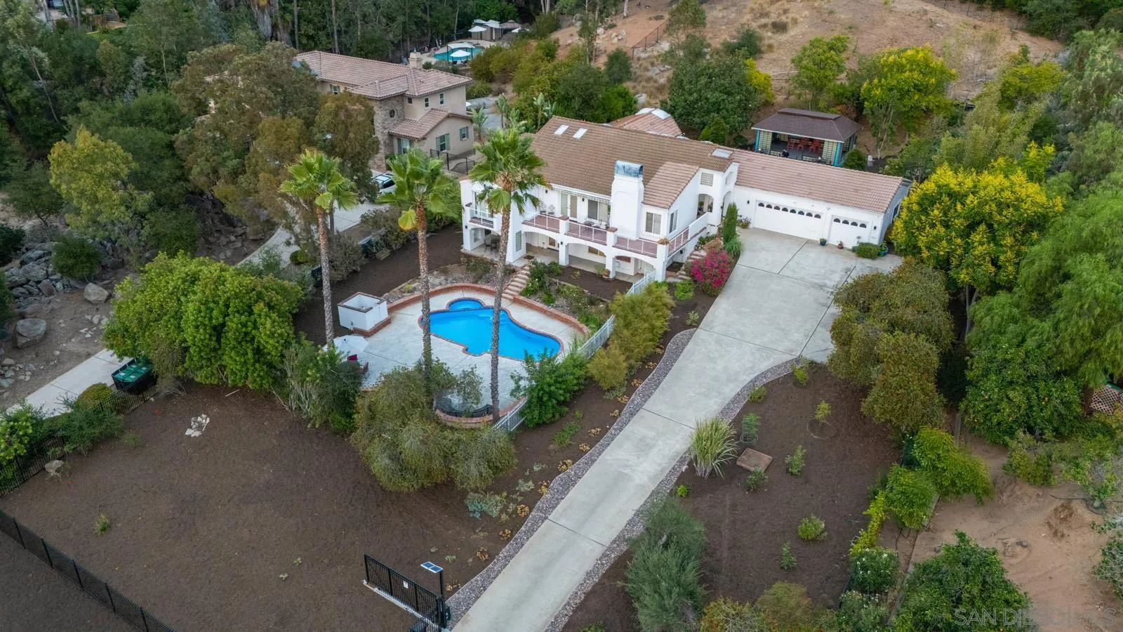 18695 Polvera Drive San Diego, CA 92128 - Photo 25 of 33 an aerial view of a house with a garden
