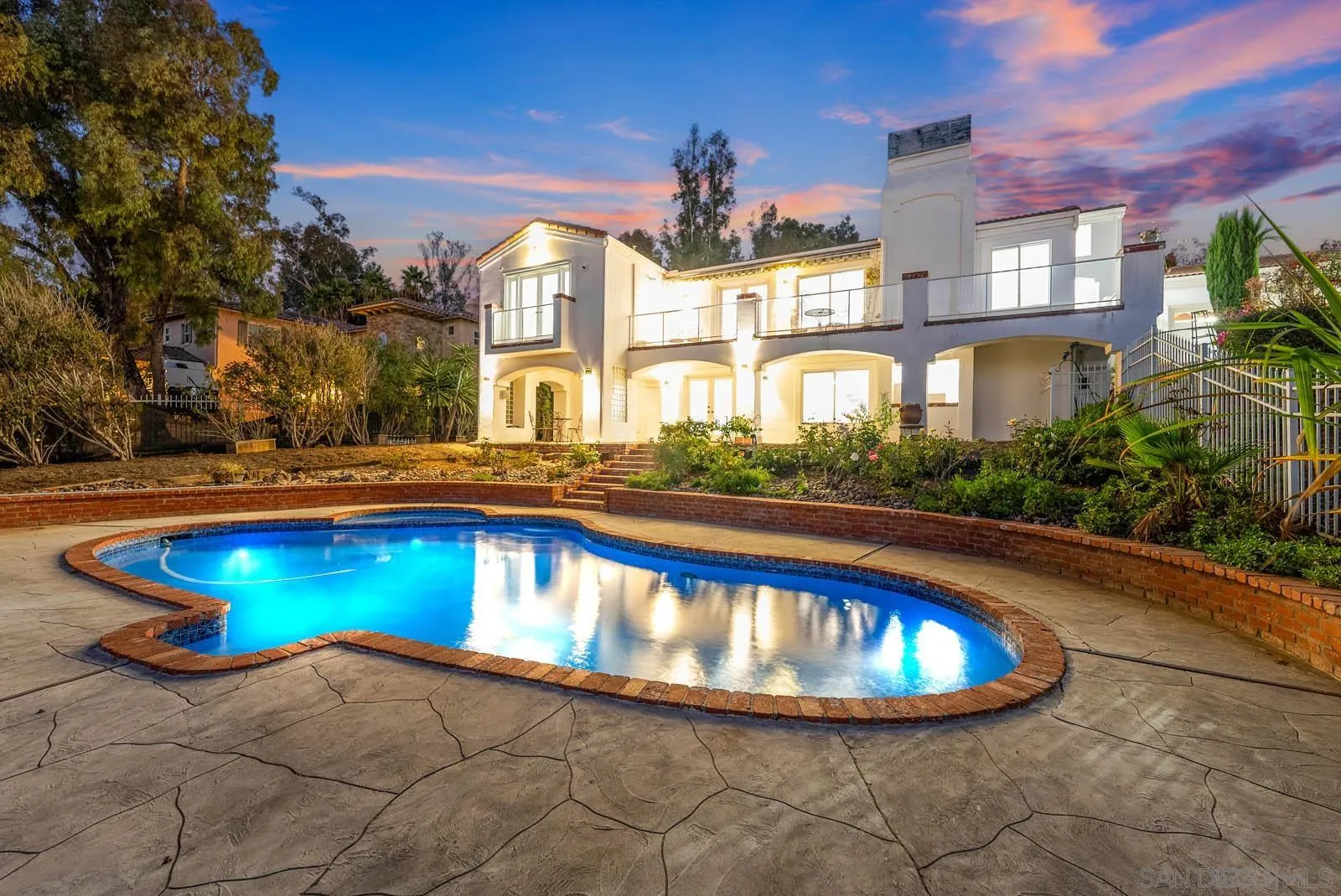 18695 Polvera Drive San Diego, CA 92128 - Photo 3 of 33 a view of a swimming pool in front of a building