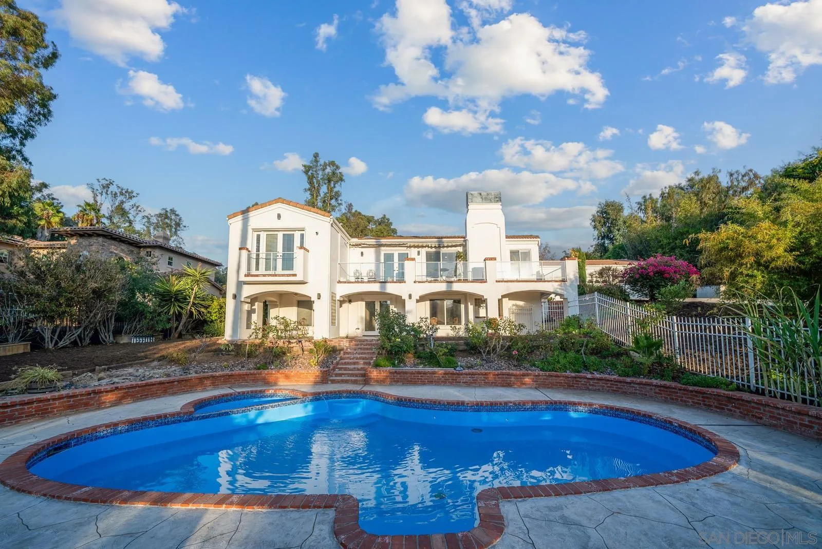 18695 Polvera Drive San Diego, CA 92128 - Photo 31 of 33 a front view of a house with swimming pool