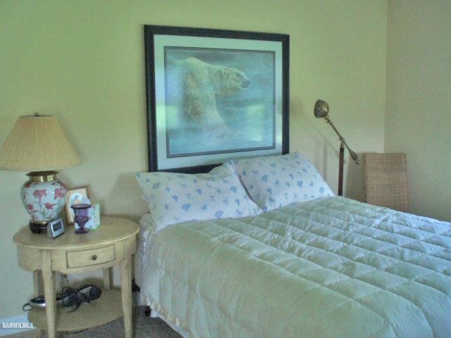 5 Beacon Trail Galena, IL 61036 - Photo 18 of 25 a bedroom with a bed and baby painting on the wall