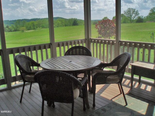 5 Beacon Trail Galena, IL 61036 - Photo 20 of 25 a view of a balcony with furniture and garden