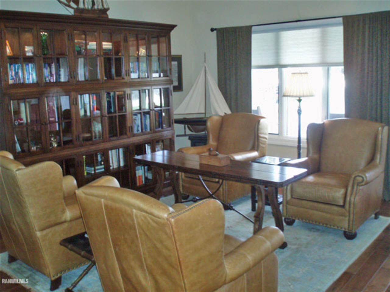 5 Beacon Trail Galena, IL 61036 - Photo 2 of 25 a living room with furniture a window and a book shelf