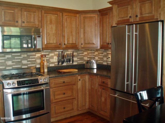 5 Beacon Trail Galena, IL 61036 - Photo 5 of 25 a kitchen with granite countertop a refrigerator stove and cabinets