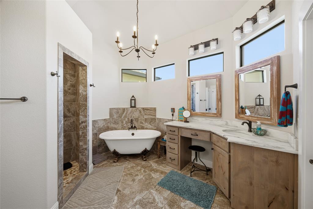 3105 Pastor Street Dallas, TX 75212 - Photo 6 of 28 Full bath with vanity, tile walls, a freestanding bath, tiled shower, and a chandelier