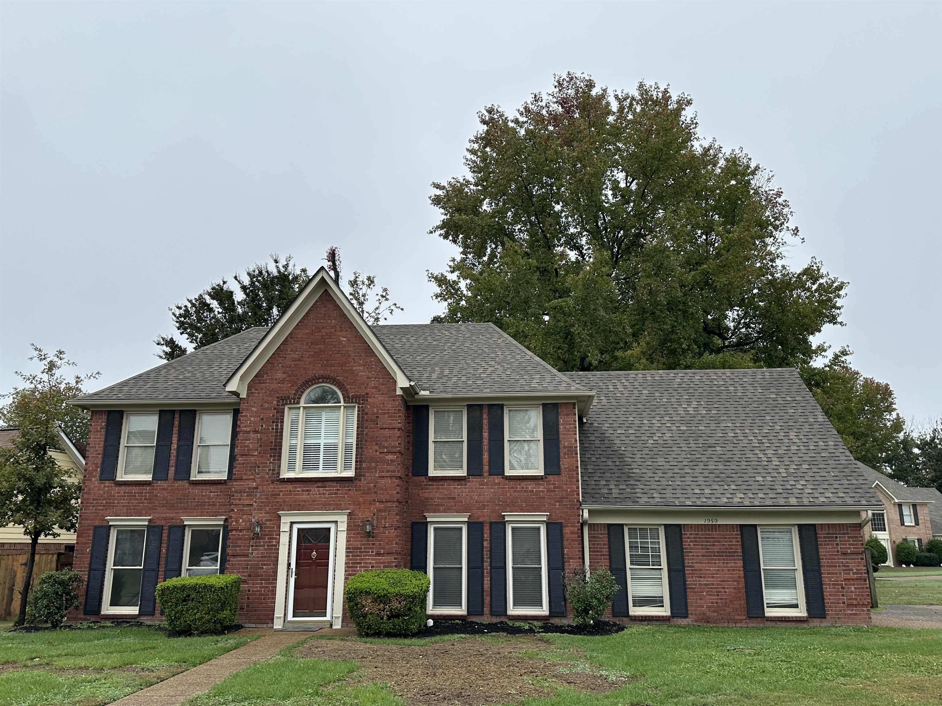 1959 Dartford Cove Memphis, TN 38016 - Photo 1 of 25 a front view of brick house with a yard