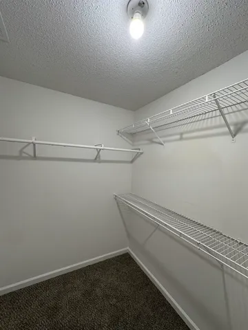 a view of a room with racks on the wall