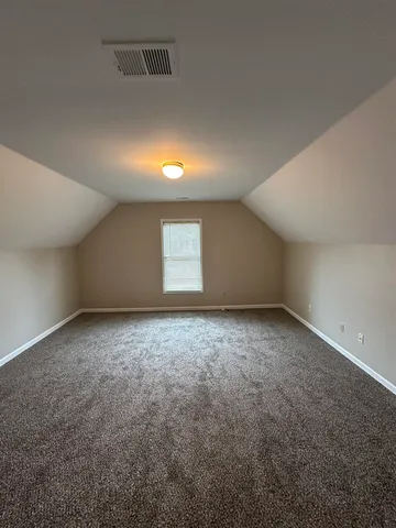 an empty room with a empty space and window